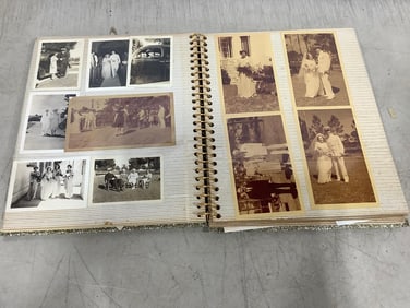 Vintage scrapbook with photographs inside