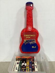 Guitar Shaped Container with Popcorn, and Various VHS Tapes