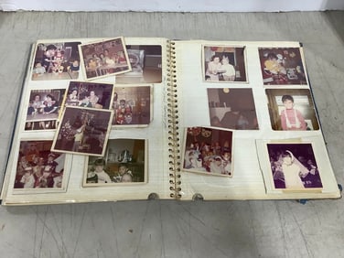 Vintage scrapbook with photographs inside