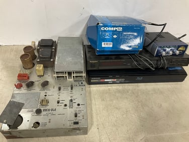 Vintage pinball machine part, Technics synthesizer AM/FM stereo tuner, Samsung blu-ray disc player,