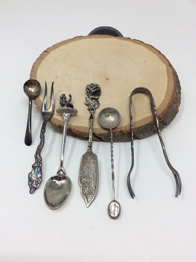 Lot of 6 collectible spoons and tongs: Lot of 6 collectible spoons and tongs