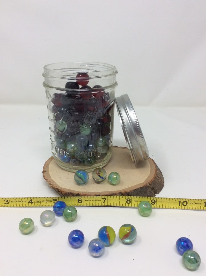 Glass jar full of marbles: Glass jar full of marbles