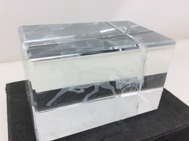Block crystal with image of man being pulled by horse(3in.x2in.x2in.)