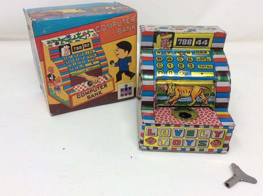 Tin compoter bank-wind up collectr's item: Tin compoter bank-wind up collectr's item