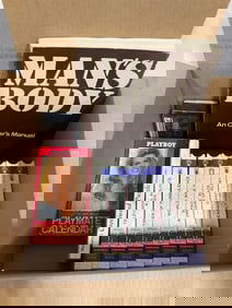 Mans Body Manual, Playboy Playmate Calendar VHS Tape, Walter Kronkite VHS Tapes, and more