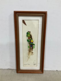 Painted feather artwork framed and signed(6.5in.x13.5in.)