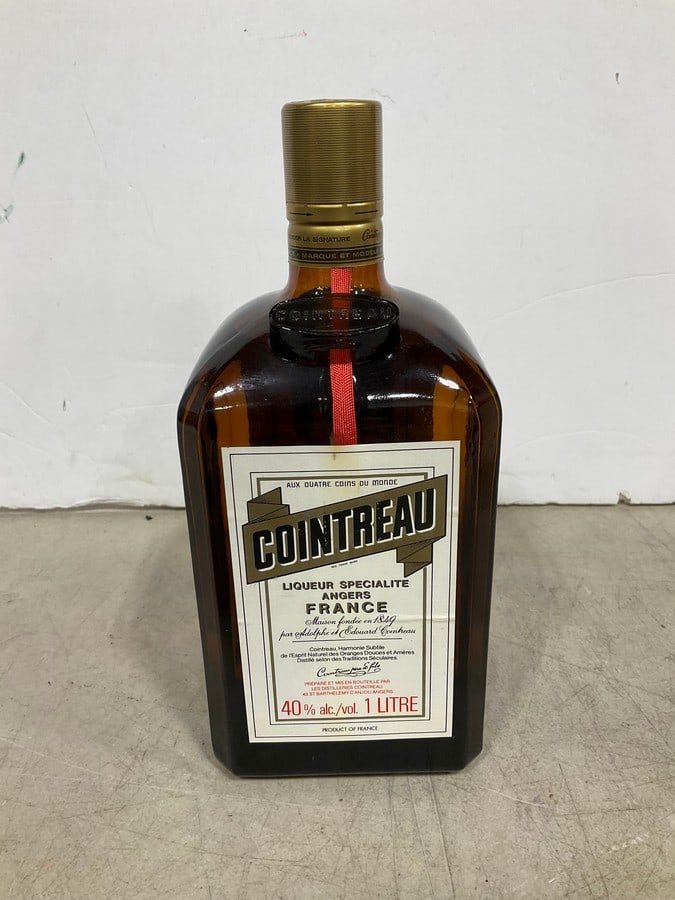 1970's/80's Cointreau(750mL): Any contents in bottle is Free; You are bidding on the bottle & unbroken tax stamp