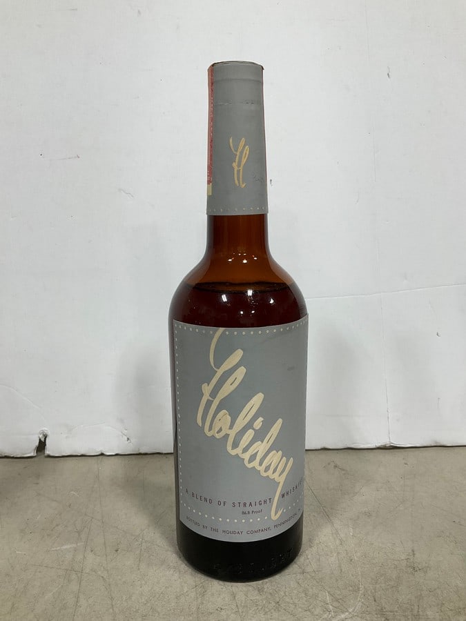 1940's Holiday Blended Straight Whiskey(750mL-RARE, sealed): Any contents in bottle is Free; You are bidding on the bottle & unbroken tax stamp