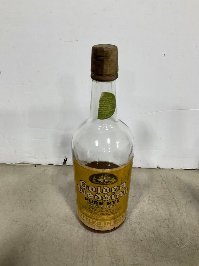 1910's Golden Wedding Pure Rye whiskey(750mL-half full-RARE): Any contents in bottle is Free; You are bidding on the bottle & unbroken tax stamp