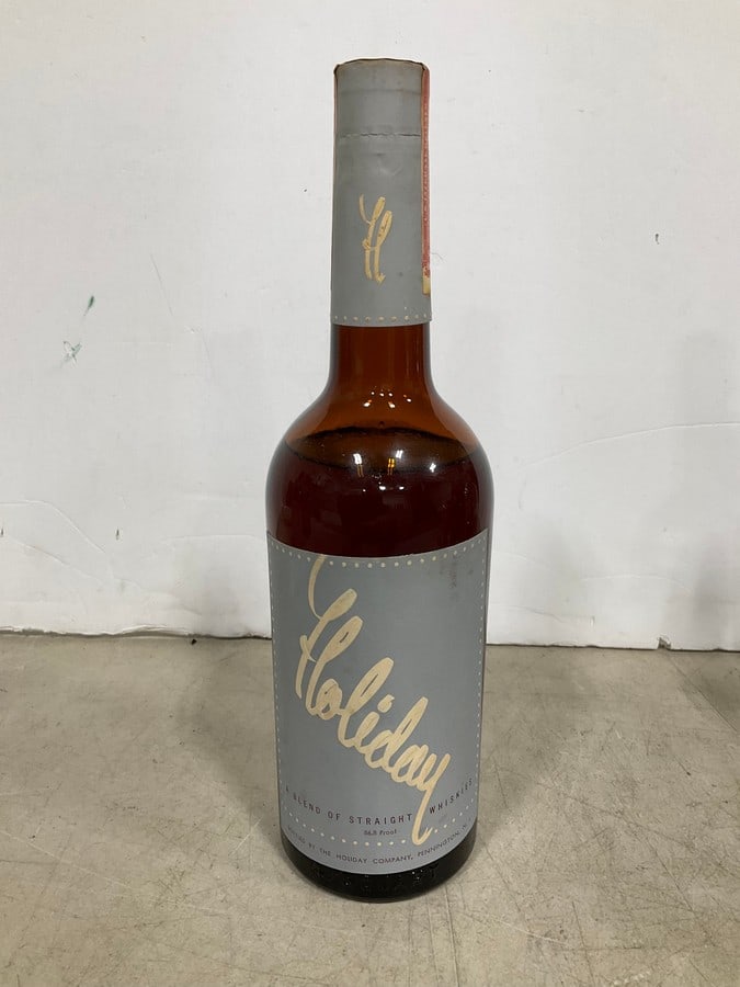 1940's Holiday Blended Straight Whiskey(750mL-RARE, sealed): Any contents in bottle is Free; You are bidding on the bottle & unbroken tax stamp