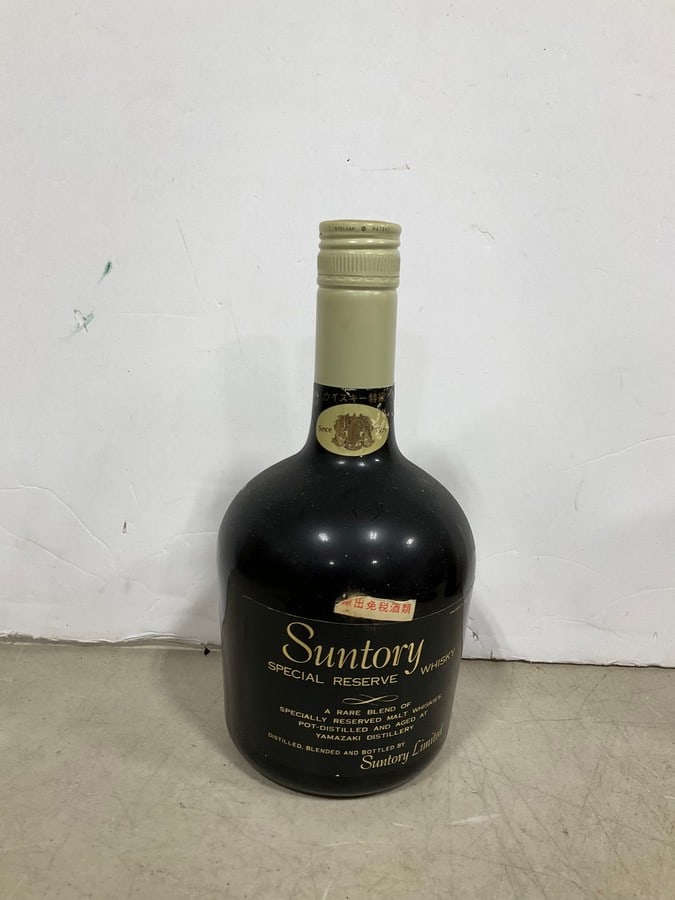 1970's Suntory japanese whisky(750mL): Any contents in bottle is Free; You are bidding on the bottle & unbroken tax stamp