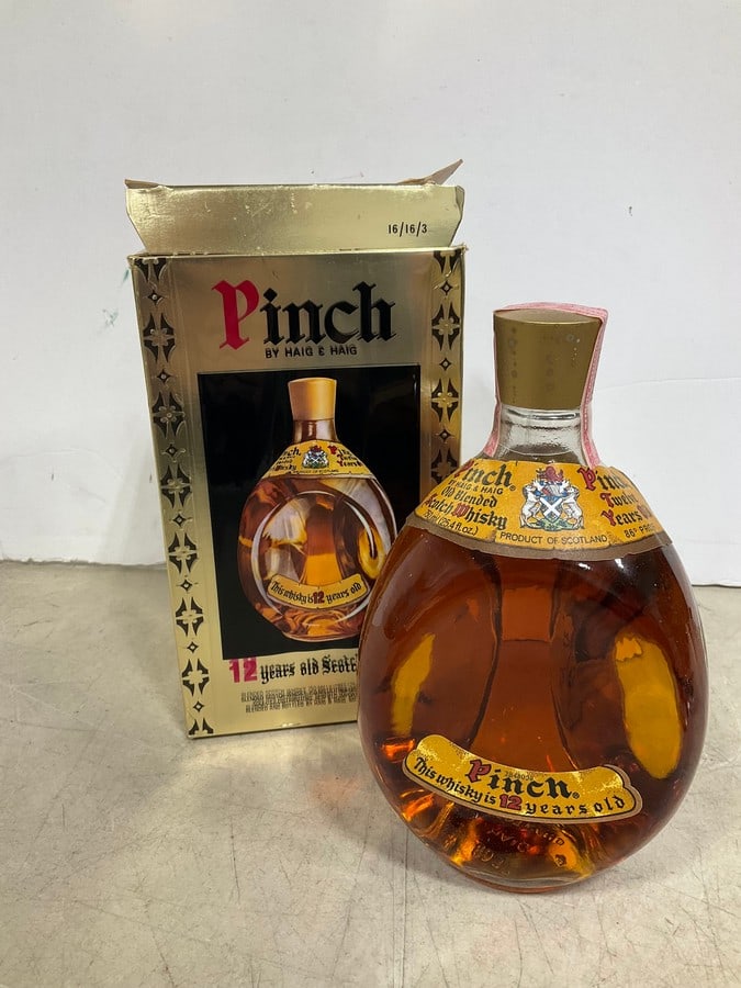 1989 Haig & Haig Pinch 12 year Scotch in box(750mL): Any contents in bottle is Free; You are bidding on the bottle & unbroken tax stamp