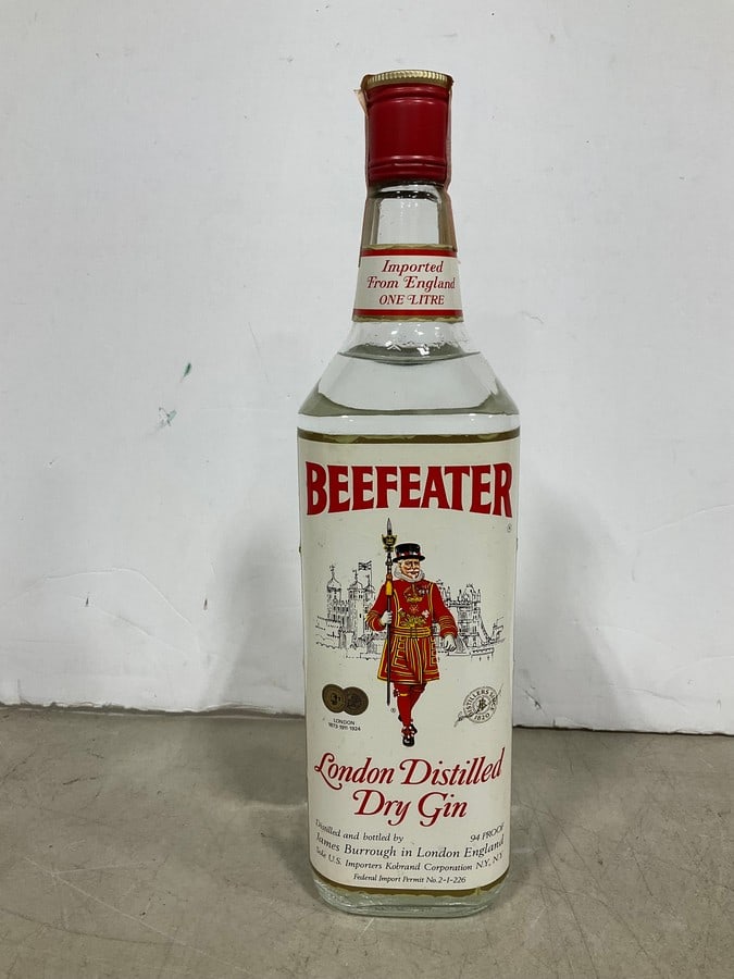 1970's Beefeater Dry Gin(1000mL-sealed): Any contents in bottle is Free; You are bidding on the bottle & unbroken tax stamp
