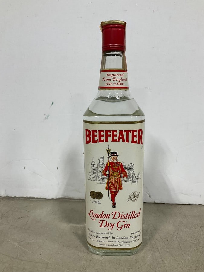1970's Beefeater Dry Gin(1000mL-sealed): Any contents in bottle is Free; You are bidding on the bottle & unbroken tax stamp