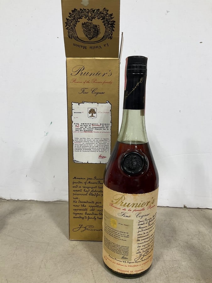 1970's Prunier's fine cognac in box(750mL): Any contents in bottle is Free; You are bidding on the bottle & unbroken tax stamp