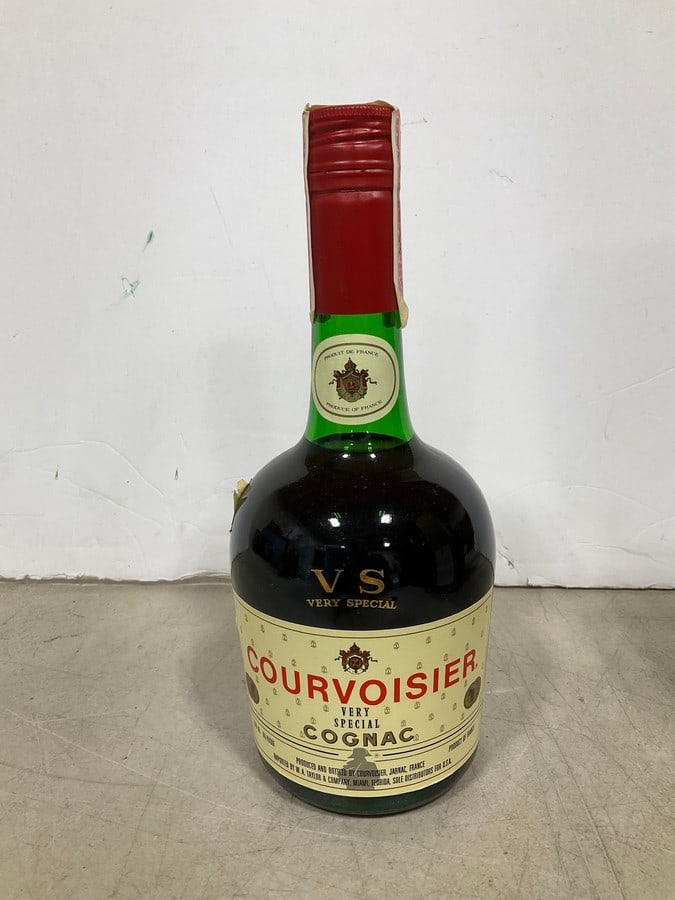 1970/1980 Courvoisier Very Special cognac(500mL): Any contents in bottle is Free; You are bidding on the bottle & unbroken tax stamp
