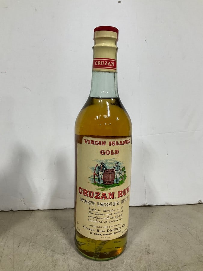 1970's Virgin Islands Gold Cruzan Rum(750mL): Any contents in bottle is Free; You are bidding on the bottle & unbroken tax stamp