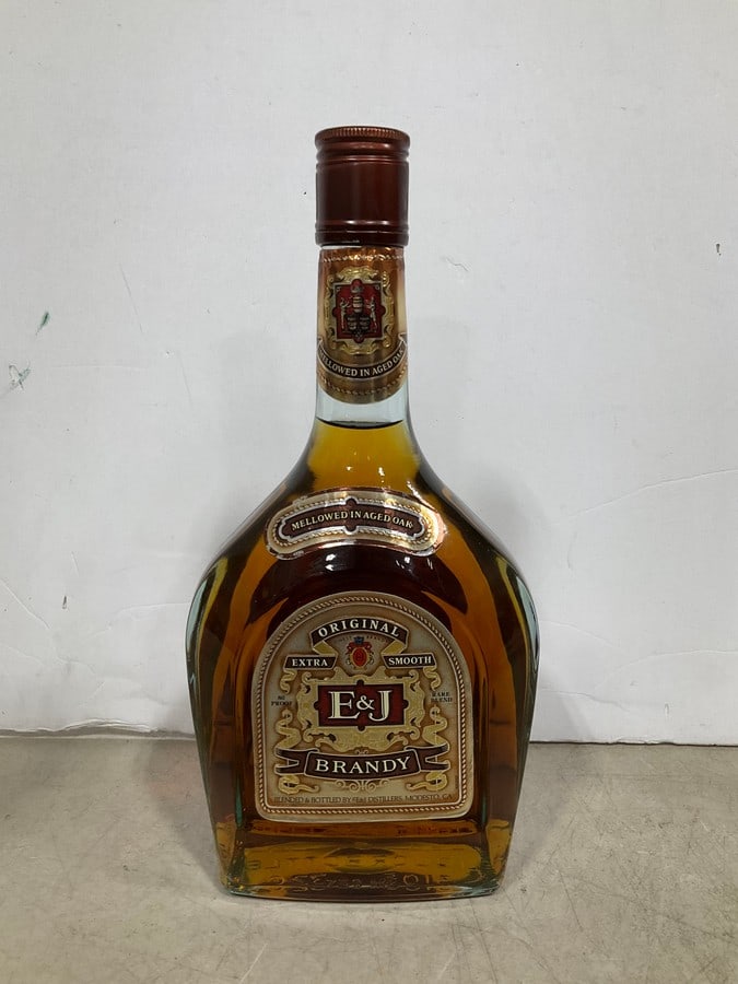 1980's E&J Brandy(750mL): Any contents in bottle is Free; You are bidding on the bottle & unbroken tax stamp