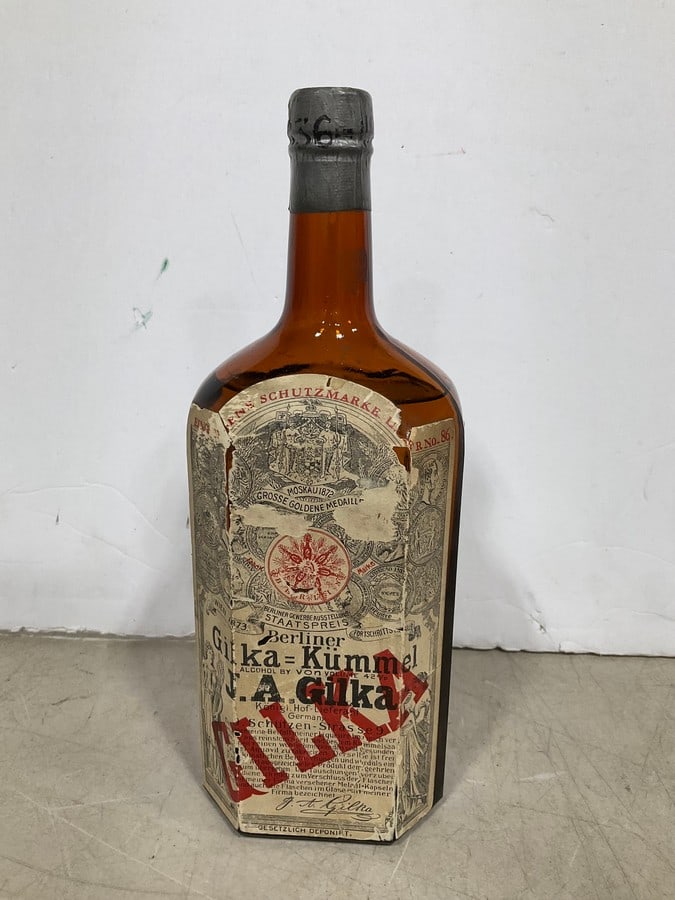 1920's Gilka liqeur(750mL): Any contents in bottle is Free; You are bidding on the bottle & unbroken tax stamp
