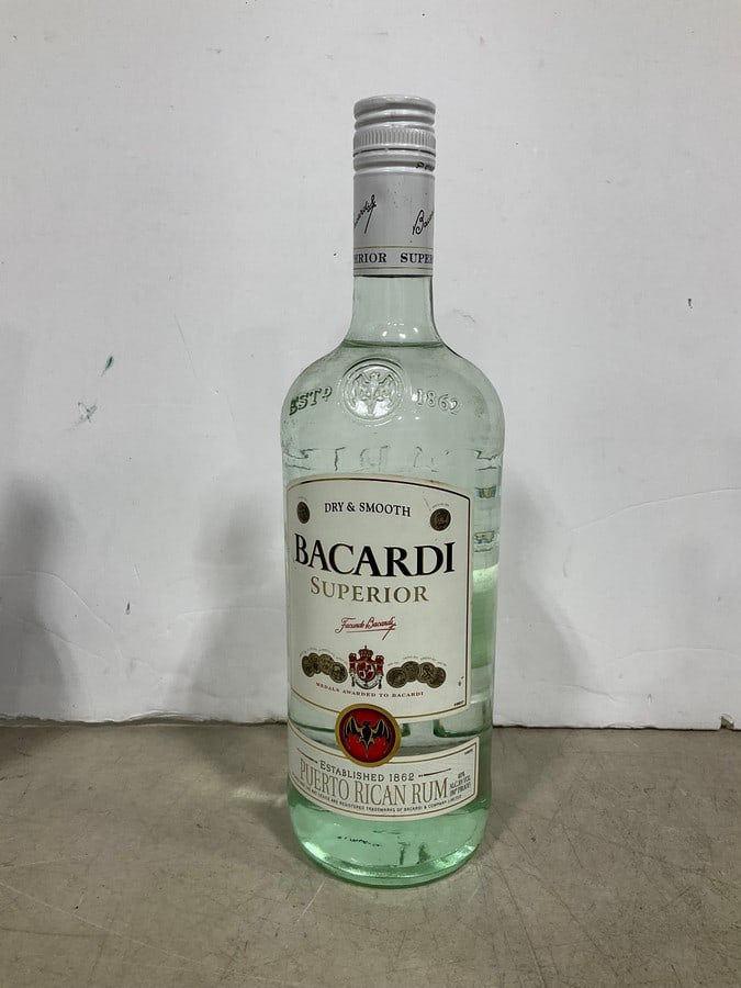Bacardi Puerto Rican rum(1L): Any contents in bottle is Free; You are bidding on the bottle & unbroken tax stamp