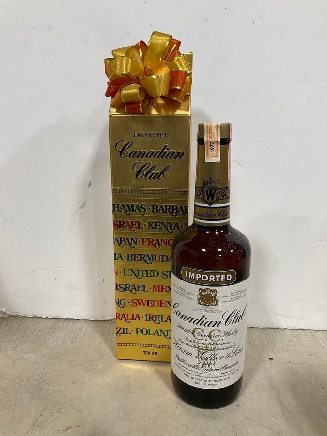 1977 Canadian Club Blended Whiskey/6 year sealedin box(750mL): Any contents in bottle is Free; You are bidding on the bottle & unbroken tax stamp