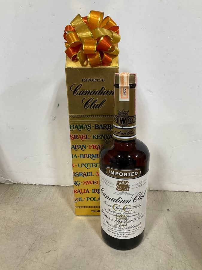 1977 Canadian Club Blended Whiskey/6 year sealedin box(750mL): Any contents in bottle is Free; You are bidding on the bottle & unbroken tax stamp