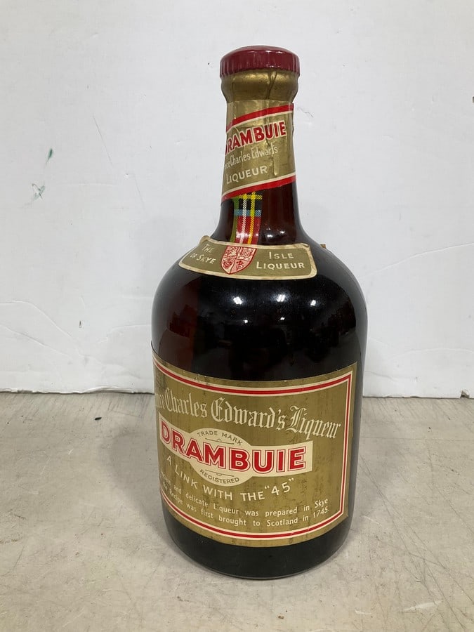1980's Prince Charles Edward's Drambuie liqueur(1L): Any contents in bottle is Free; You are bidding on the bottle & unbroken tax stamp