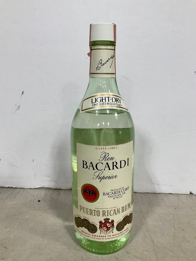 Ron Bacardi silver label light dry puerto rican rum(1L): Any contents in bottle is Free; You are bidding on the bottle & unbroken tax stamp