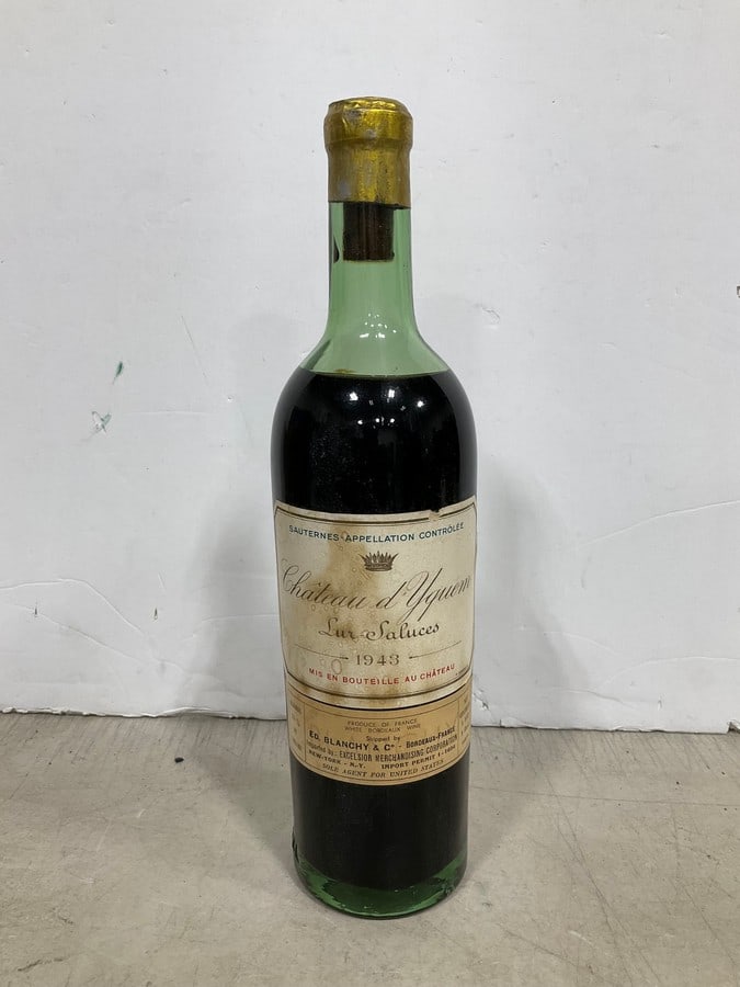 1943 Chateau d Yguen(1pt.): Any contents in bottle is Free; You are bidding on the bottle & unbroken tax stamp