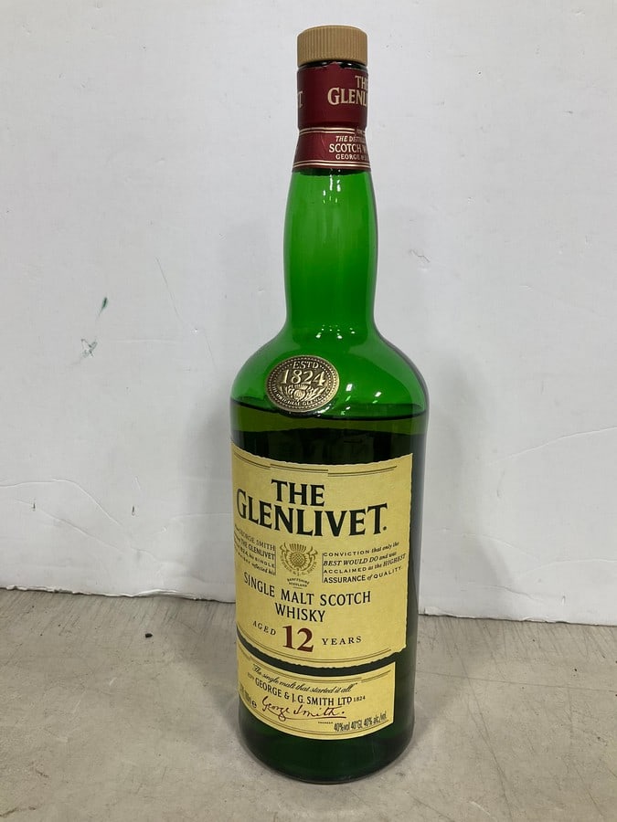 The Glevlivet single malt scotch whisky(1000mL-over half full): Any contents in bottle is Free; You are bidding on the bottle & unbroken tax stamp