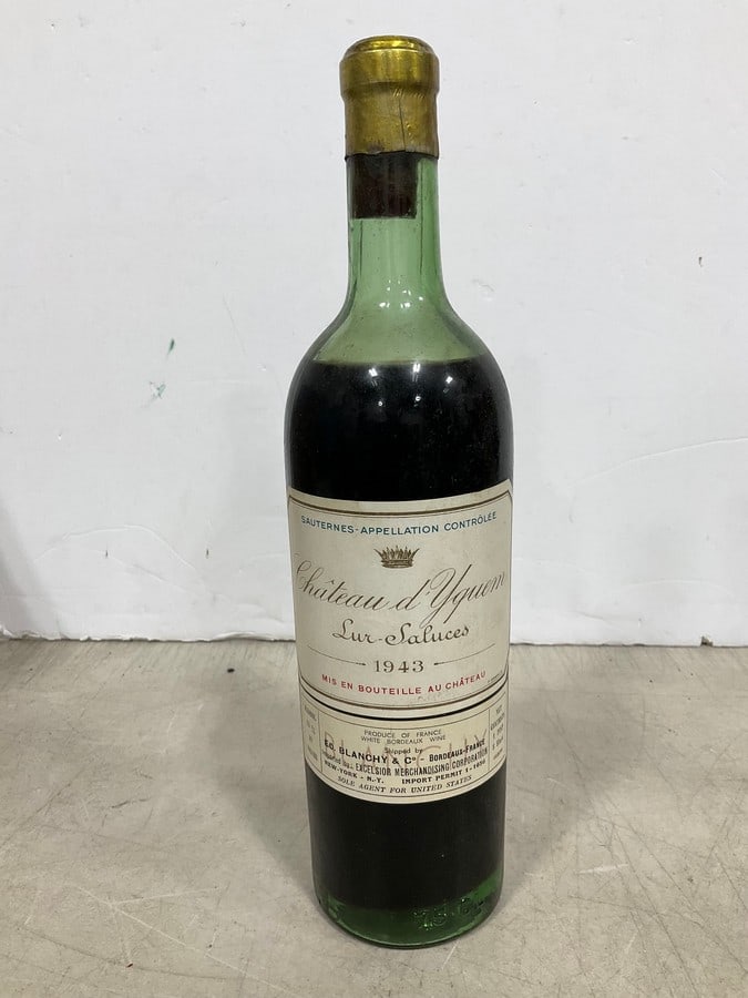 1943 Chateau d Yguen(1pt.): Any contents in bottle is Free; You are bidding on the bottle & unbroken tax stamp