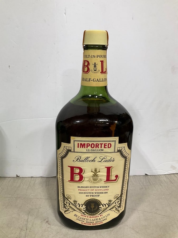 Bulloch Lade's blended scotch whisky(haf gallon, sealed): Any contents in bottle is Free; You are bidding on the bottle & unbroken tax stamp
