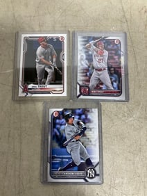 Anthony Volpe and Mike Trout collectible cards in covers