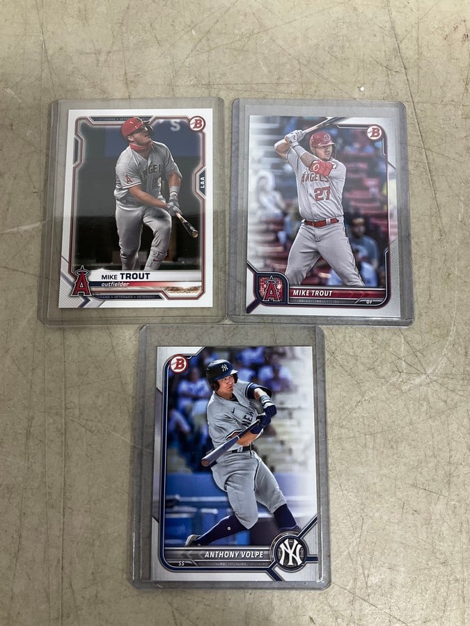 Anthony Volpe and Mike Trout collectible cards in covers: Anthony Volpe and Mike Trout collectible cards in covers