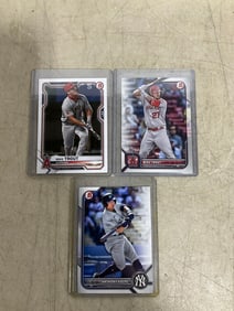 Anthony Volpe and Mike Trout collectible cards in covers