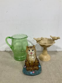 Cat statue, green glass pitcher, and more