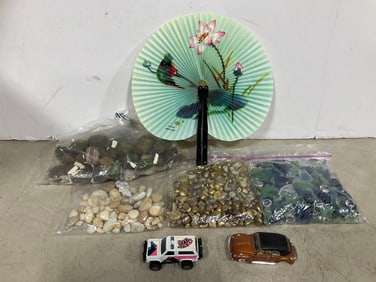 Various decorative rocks, handmade fan, and more