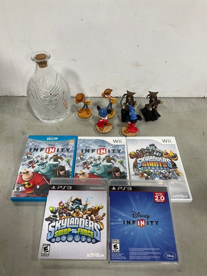 Disney Infinity figures, Wii/WiiU/PS3 games, and Courvoisier bottle(8in.tall): Disney Infinity figures, Wii/WiiU/PS3 games, and Courvoisier bottle(8in.tall)