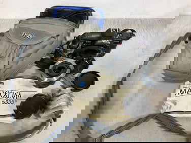 Vintage Minolta camera with carrying case and attachments