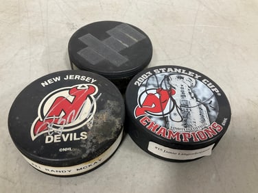 Player signed hokey pucks(2 signed)