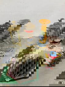 Scrapbook with photographs, ceramic candleholder, and more