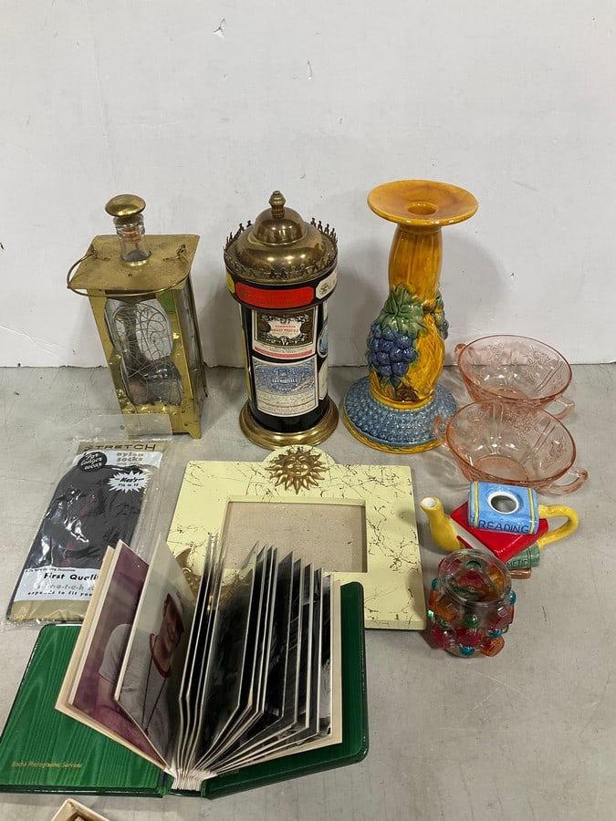 Scrapbook with photographs, ceramic candleholder, and more: Scrapbook with photographs, ceramic candleholder, and more