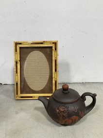 Boise frame and oriental teapot