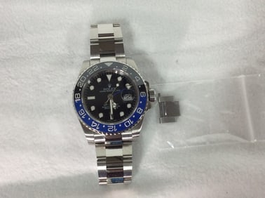 Preowned Rolex GMT-Master II 116710 batman with ceramic bezel and date magnification from prominent