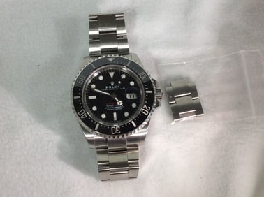 Preowned Rolex Sea-Dweller Stainless Steel 126600 Red Lettering Dial with ceramic bezel and date