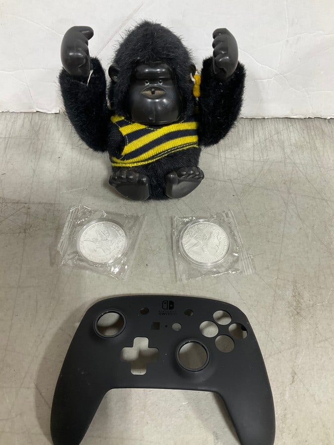 Gorilla doll and Nintendo switch controller cover (1 of 1)