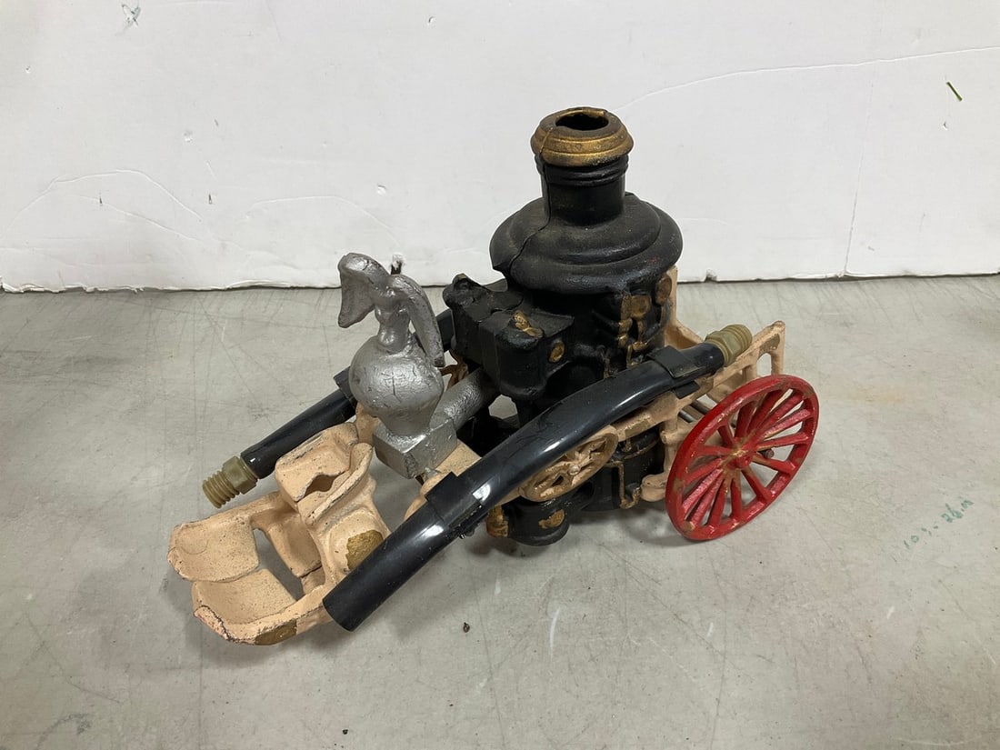 Vintage cast iron toy fire pumper wagon (1 of 1)