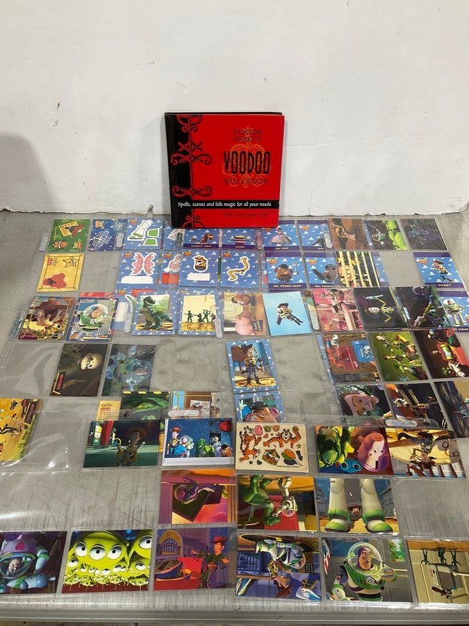 Collectible Toy Story trading cards and Doktor Snakes voodoo spellbook: Collectible Toy Story trading cards and Doktor Snakes voodoo spellbook