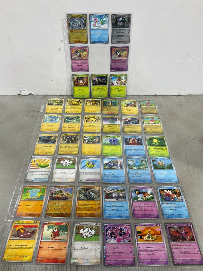Various Pokemon cards in collector sheets (1 of 1)