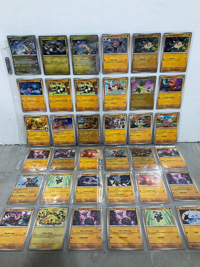 Various Pokemon cards in collector sheets (1 of 1)
